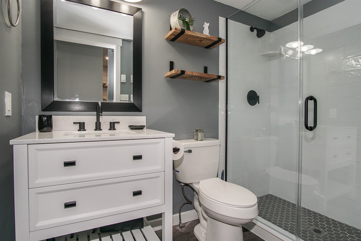 Beautifully updated bathroom with walk-in shower and sleek design.