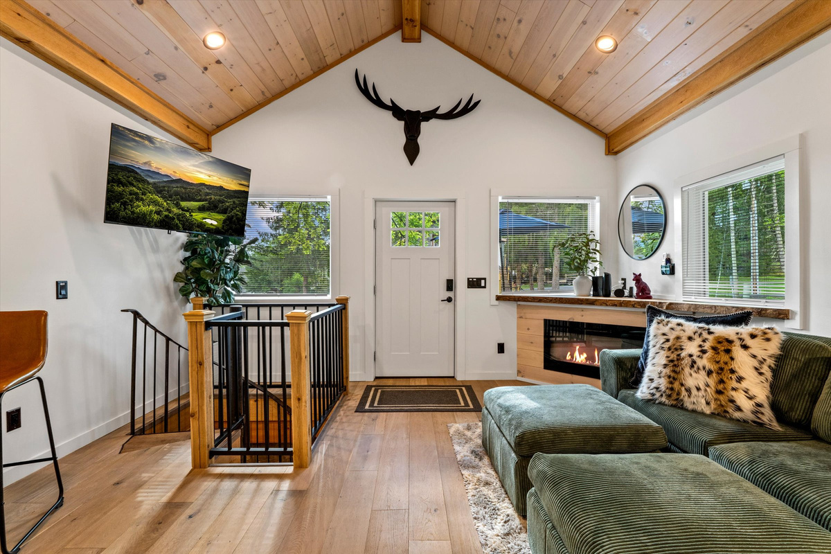 Cozy Living Room with 55-inch Smart TV, Fireplace, and bistro table.