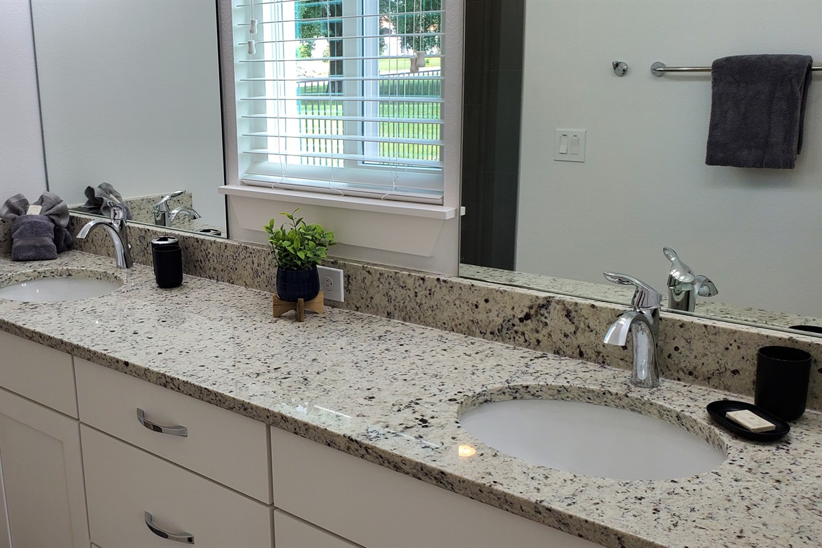 Master King bedroom ensuite - double sink, toilet and large walk-in shower.