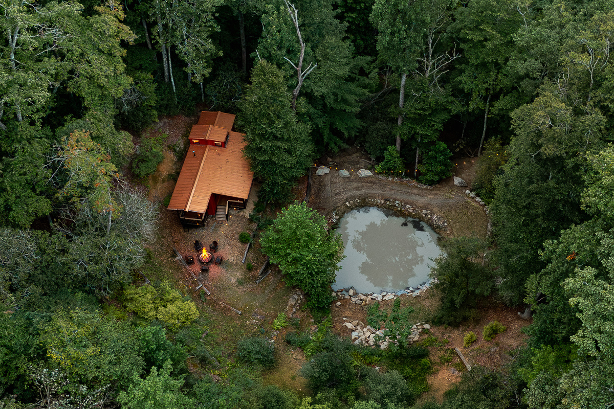 {Hidden Caboose & Pond} Follow the private forest trail to your own tucked-away caboose and pond, one of the most unique surprises at Canopy Club.