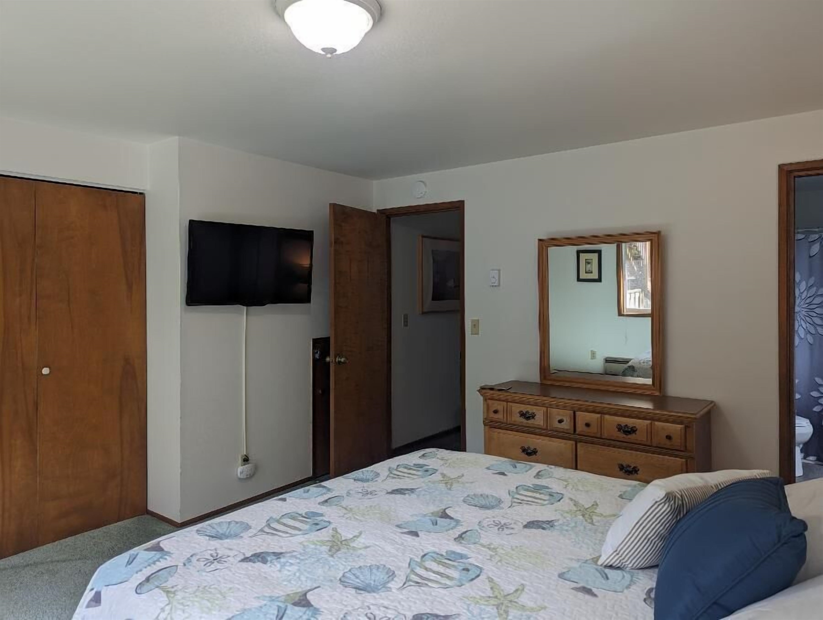 queen bedroom with TV