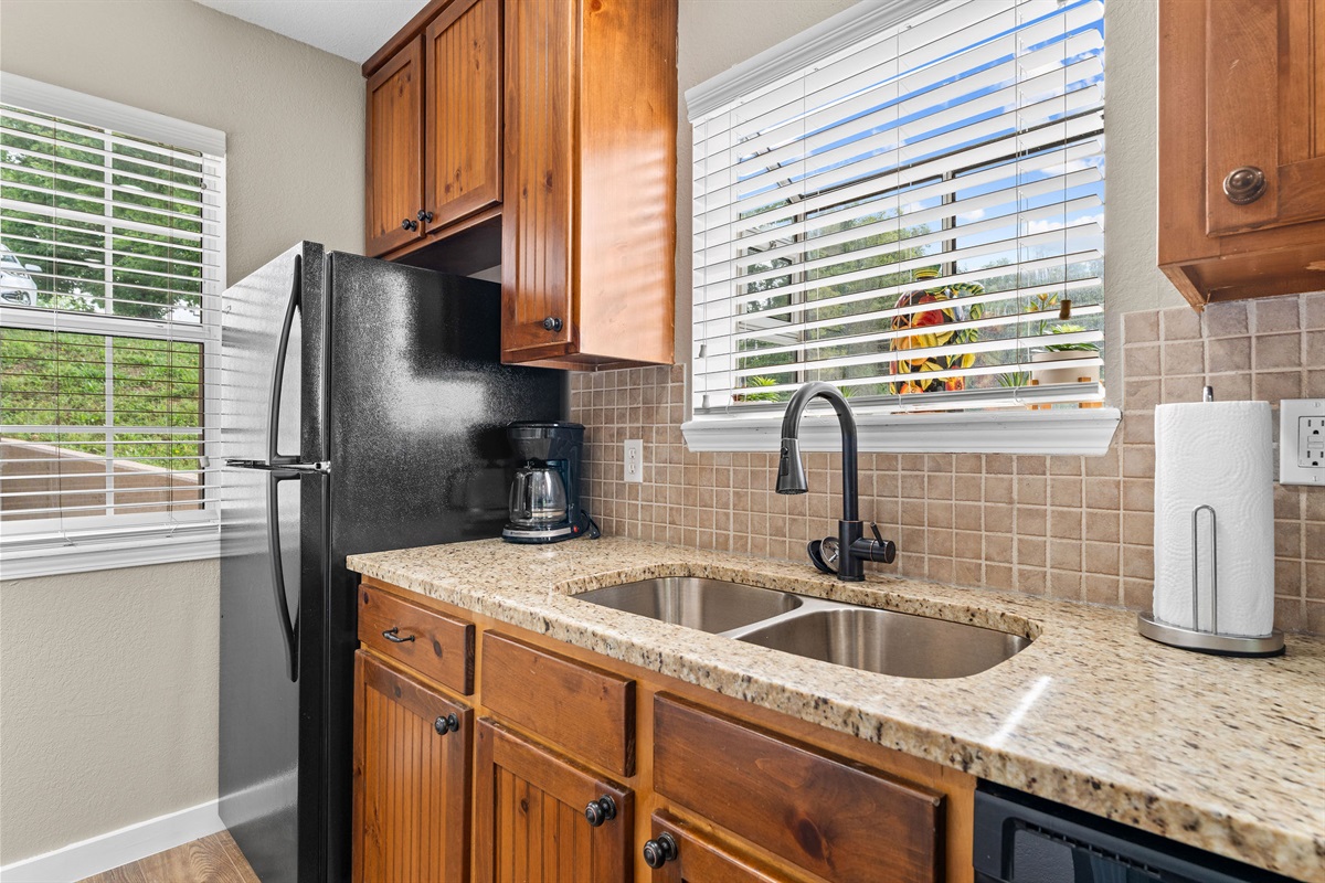 Enjoy this fully equipped kitchen with full-size fridge, dishwasher, coffee maker, and plenty of counter space.