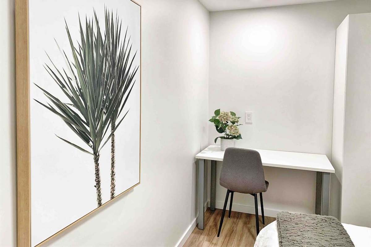 Dedicated workspace located in the primary bedroom with desk and chair.