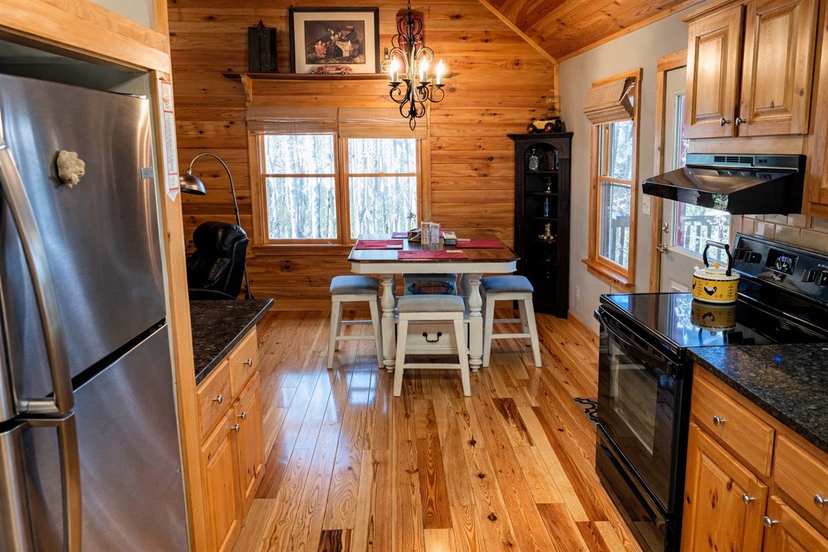 A bright and cozy cabin kitchen—perfect for morning coffee, home-cooked meals, and gathering after a day in the mountains