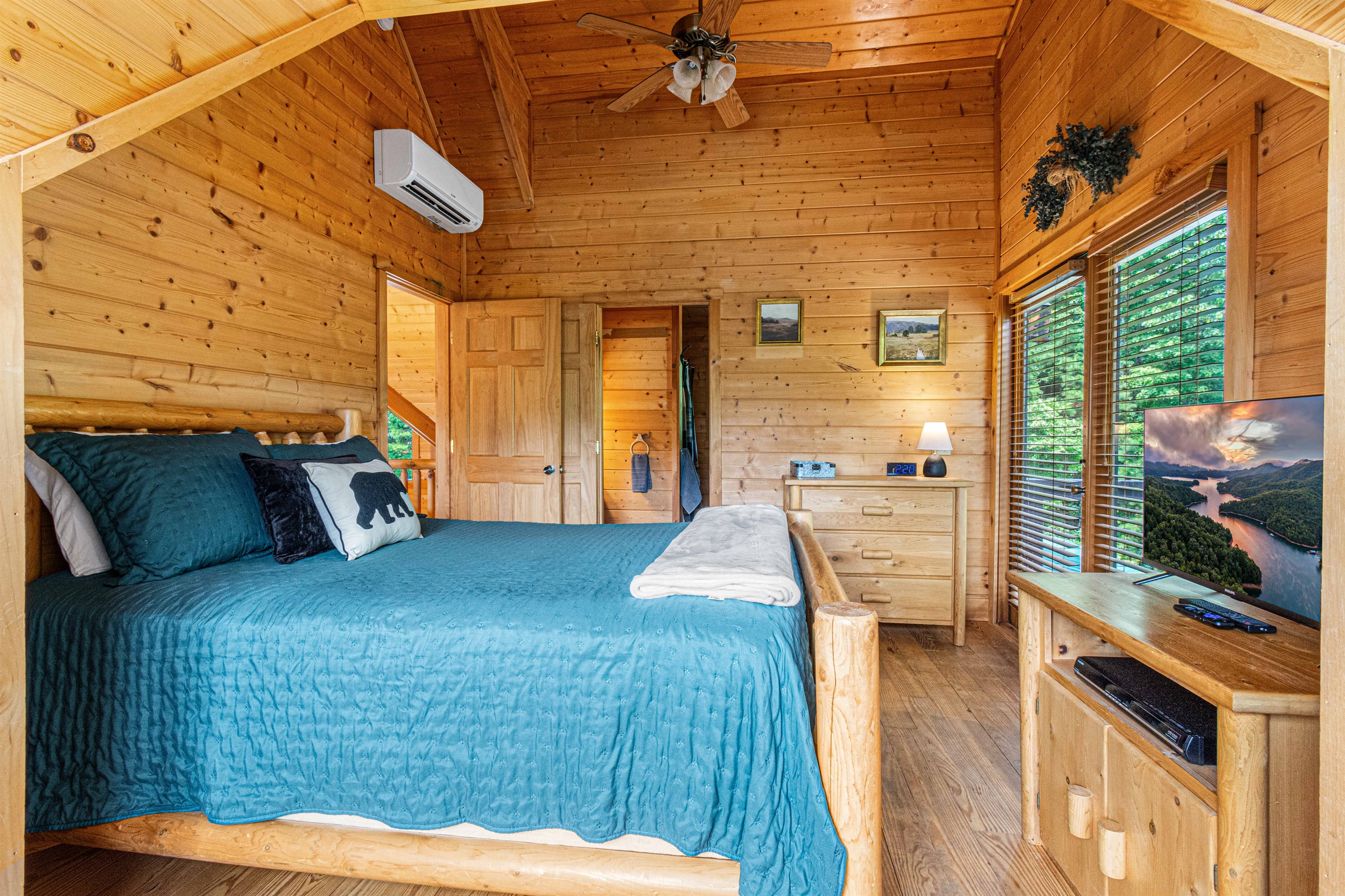 Upstairs Bedroom 2: Tranquil retreat with rustic charm, stunning views, and a plush king bed!