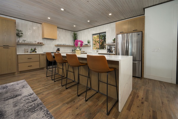 The heart of the cabin—cook, sip, and gather around this spacious kitchen island designed for togetherness