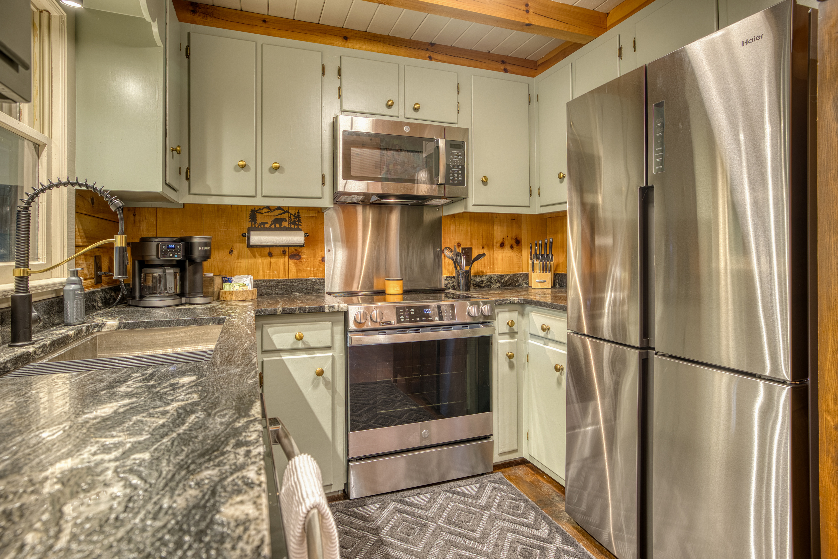 Kitchen with a stainless fridge and range.