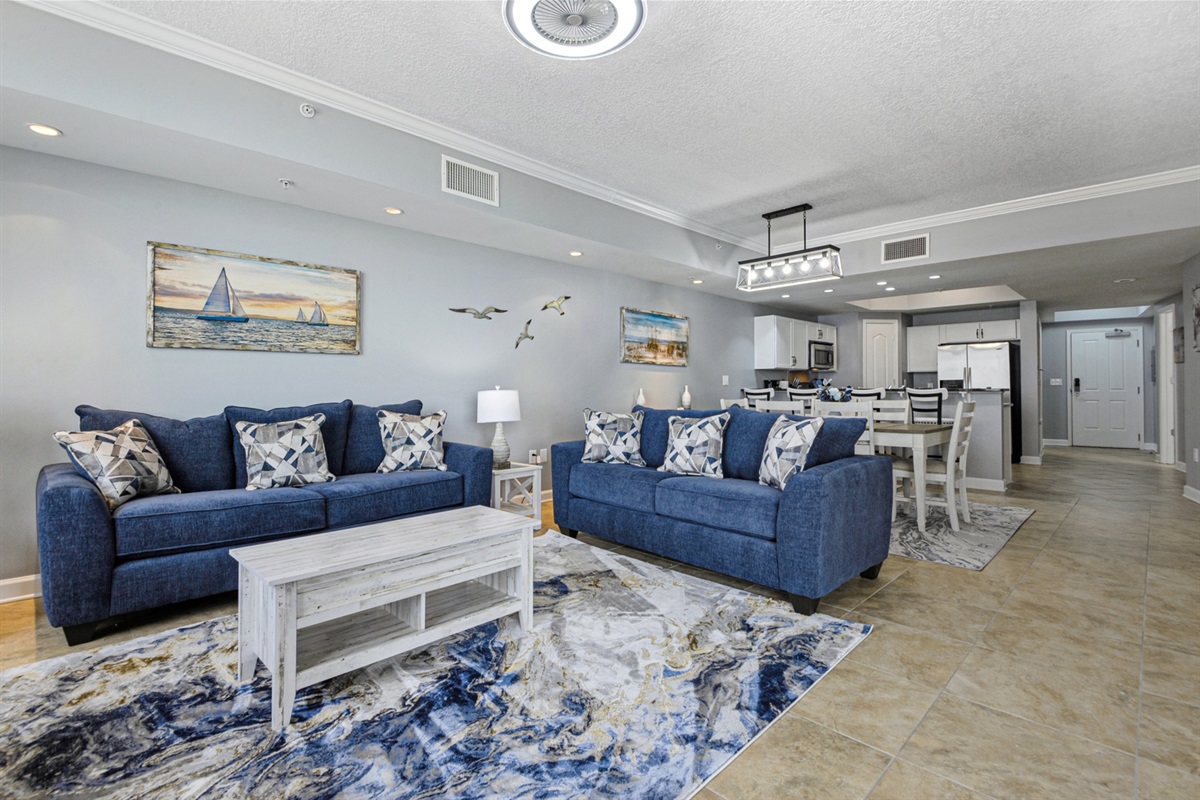 Living room looking into dining and kitchen.