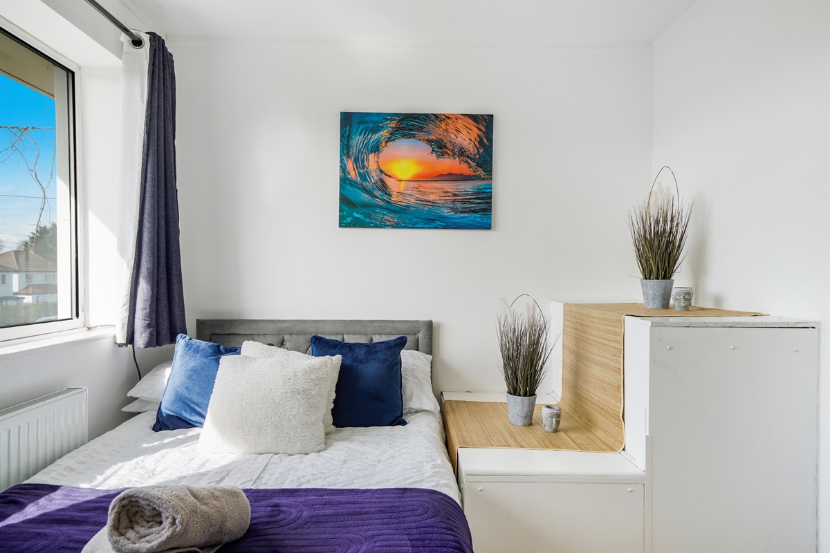 [Comfortable double bed with chest of drawer storage]