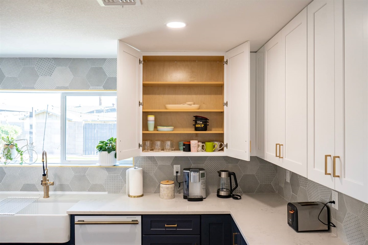 Thoughtfully stocked kitchen with mugs, glassware, and essentials—everything you need for coffee, meals, and easy stays in Scottsdale