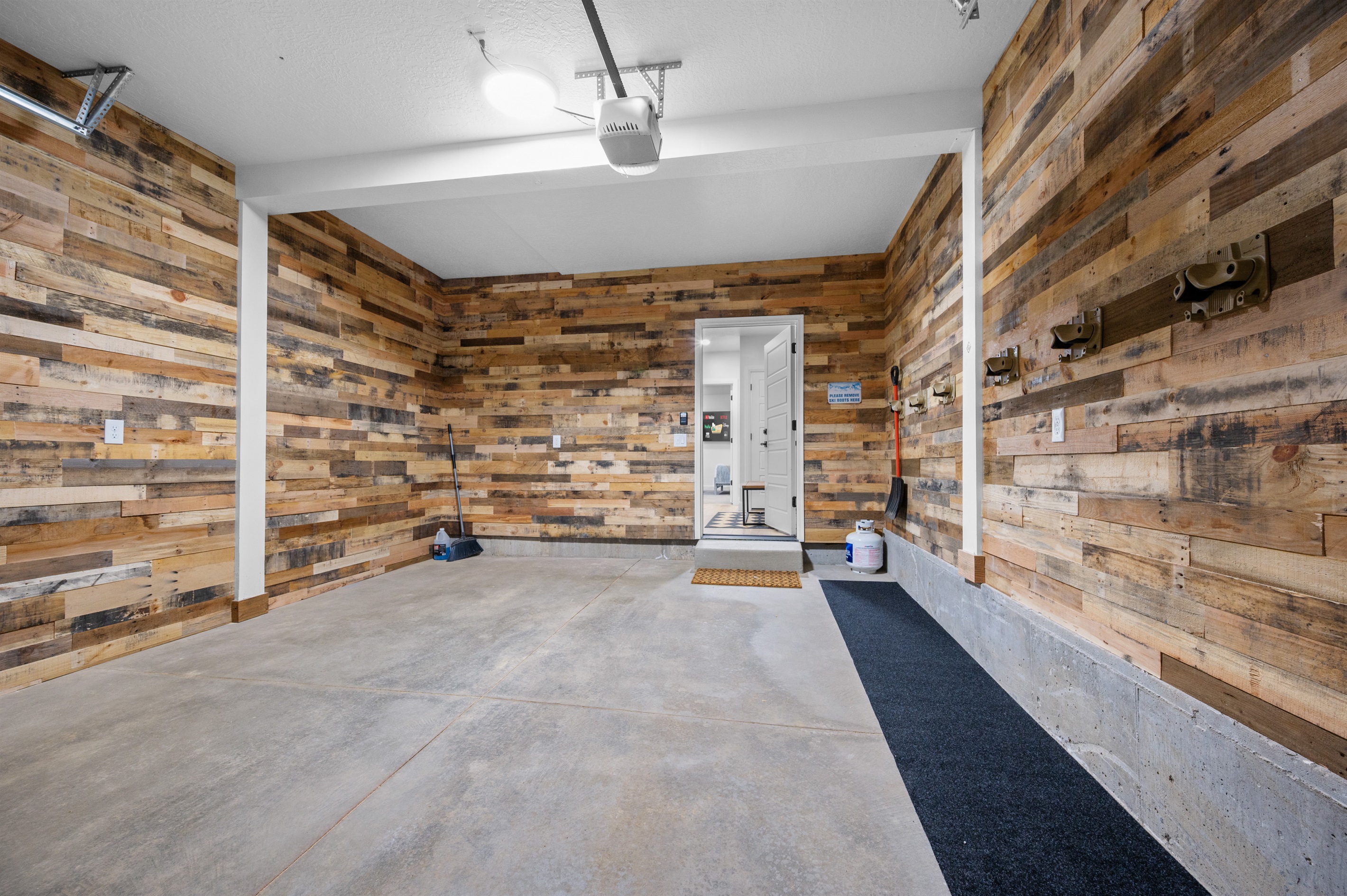 Spacious garage with direct entry to the mudroom.