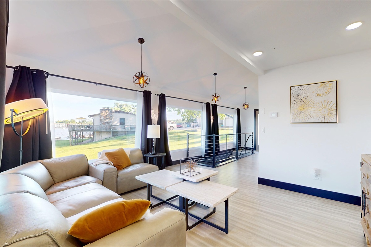 Upstairs main living room with grand views and modern decor.