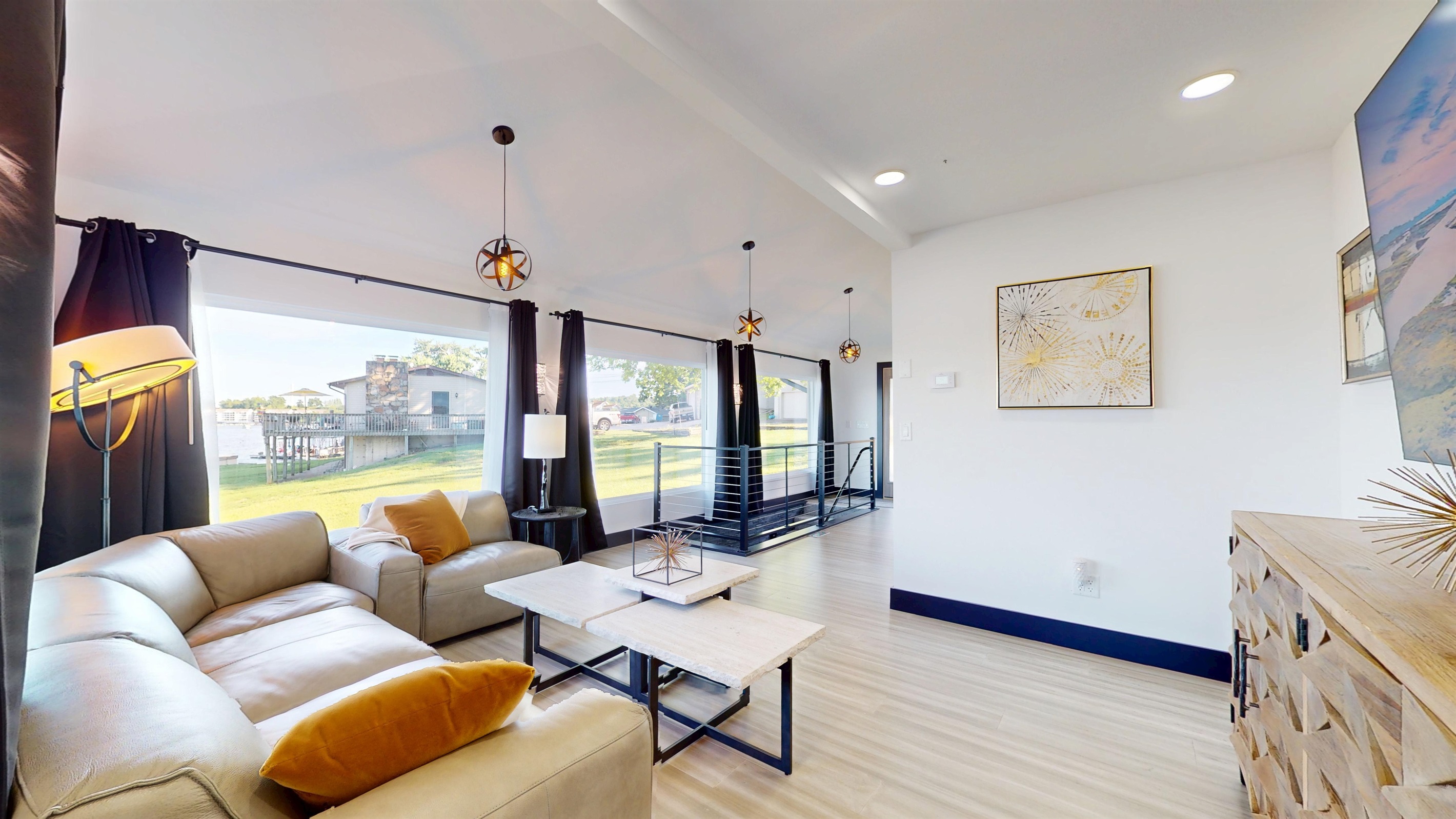 Upstairs main living room with grand views and modern decor.