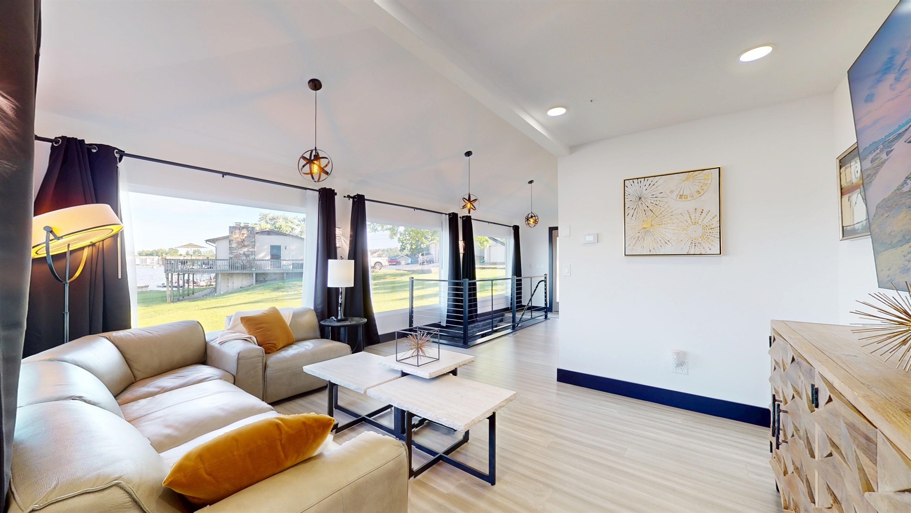 Upstairs main living room with grand views and modern decor.