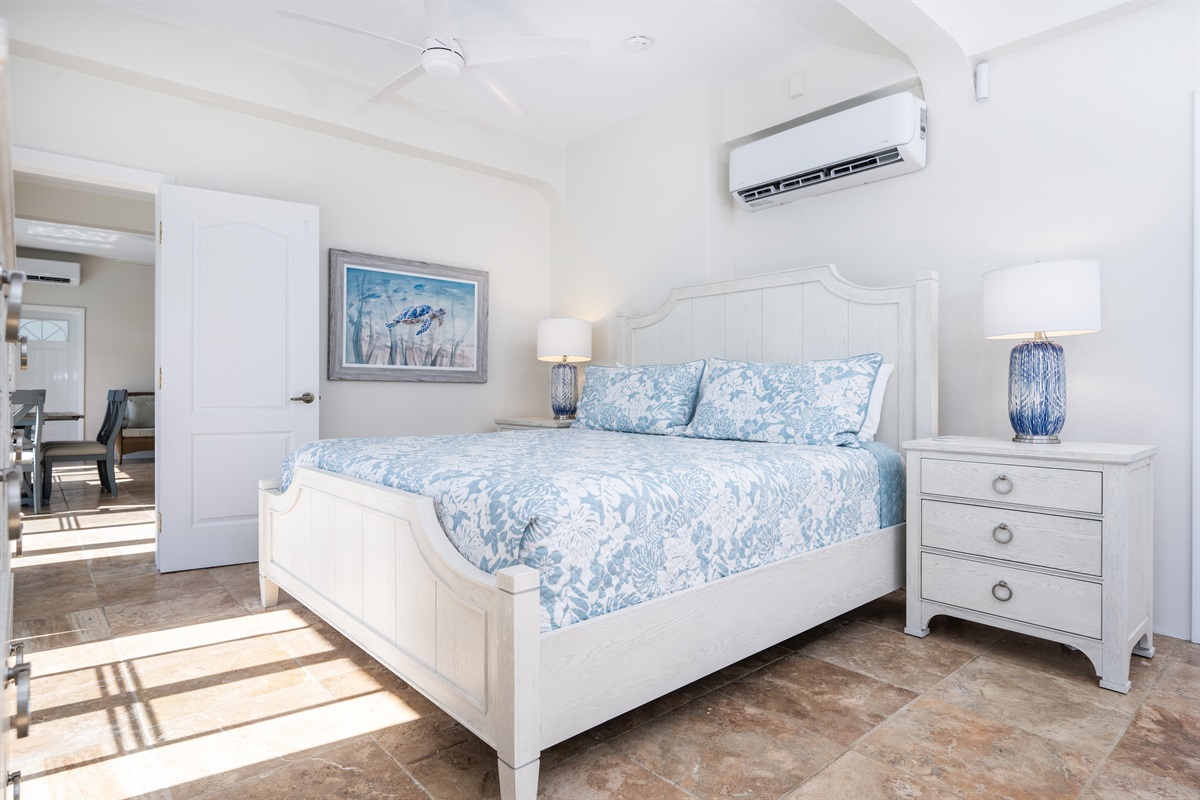 Downstairs Apartment Bedroom: A perfect blend of sophistication and island charm at every turn. This apartment bedroom has its own bathroom.