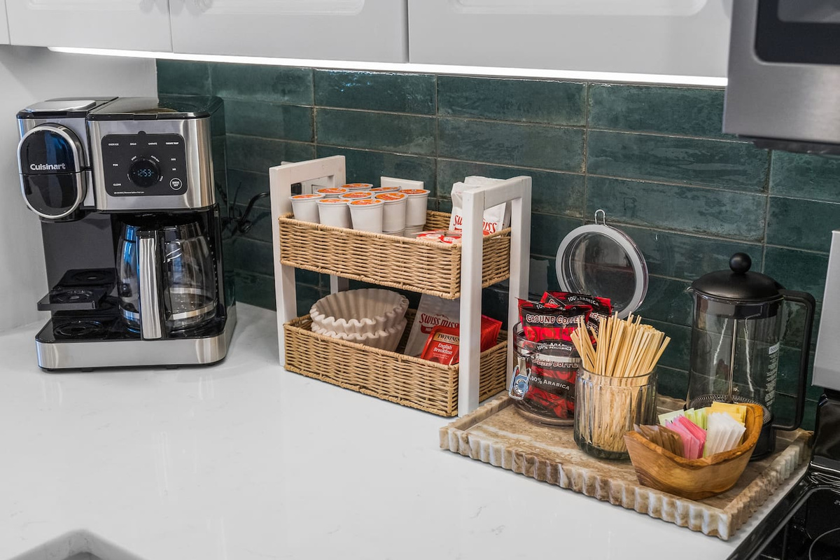 Coffee bar includes dual Cuisninart Single Serve + 12 cup carafe.  K-cups, ground coffee, tea, sugars, french press, and hot chocolate for the kids!  To-go cups also available for morning strolls on the beach.