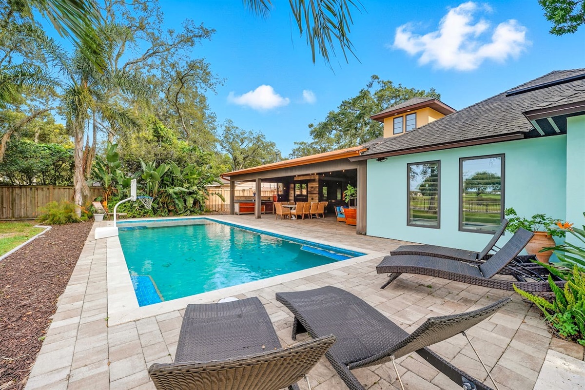 Heated pool, tropical patio, and covered dining on the 17th green.