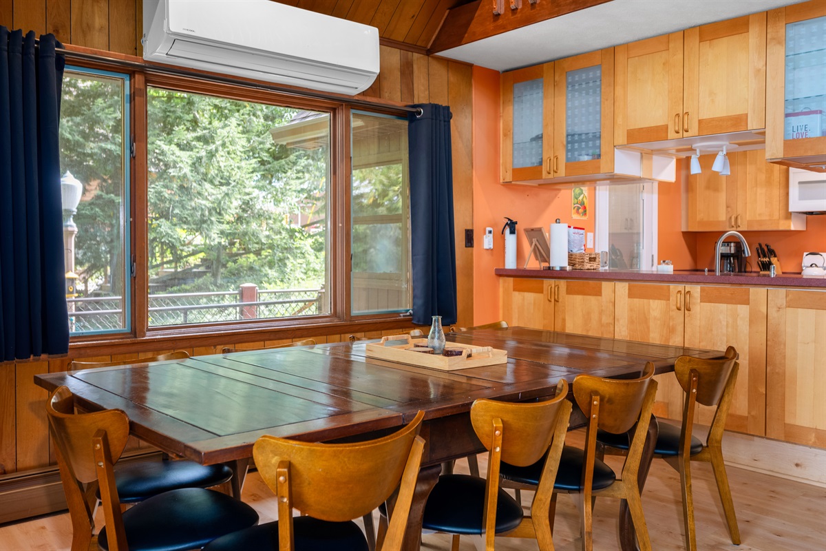 Dining area with large windows overlooking the lake
