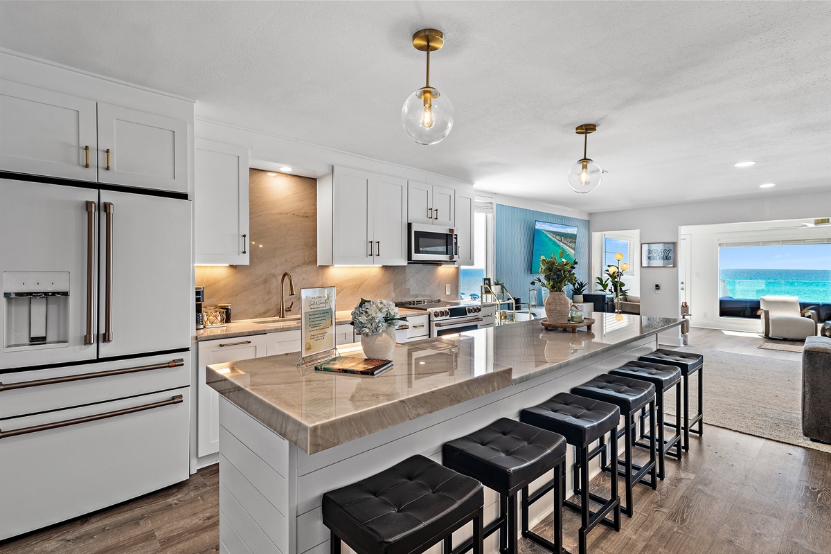 Green Reef 1 has a Remodeled Kitchen with Quartz Countertop, Luxury Appliances - cook delicious meals and dine while overlooking the Gulf of Mexico!