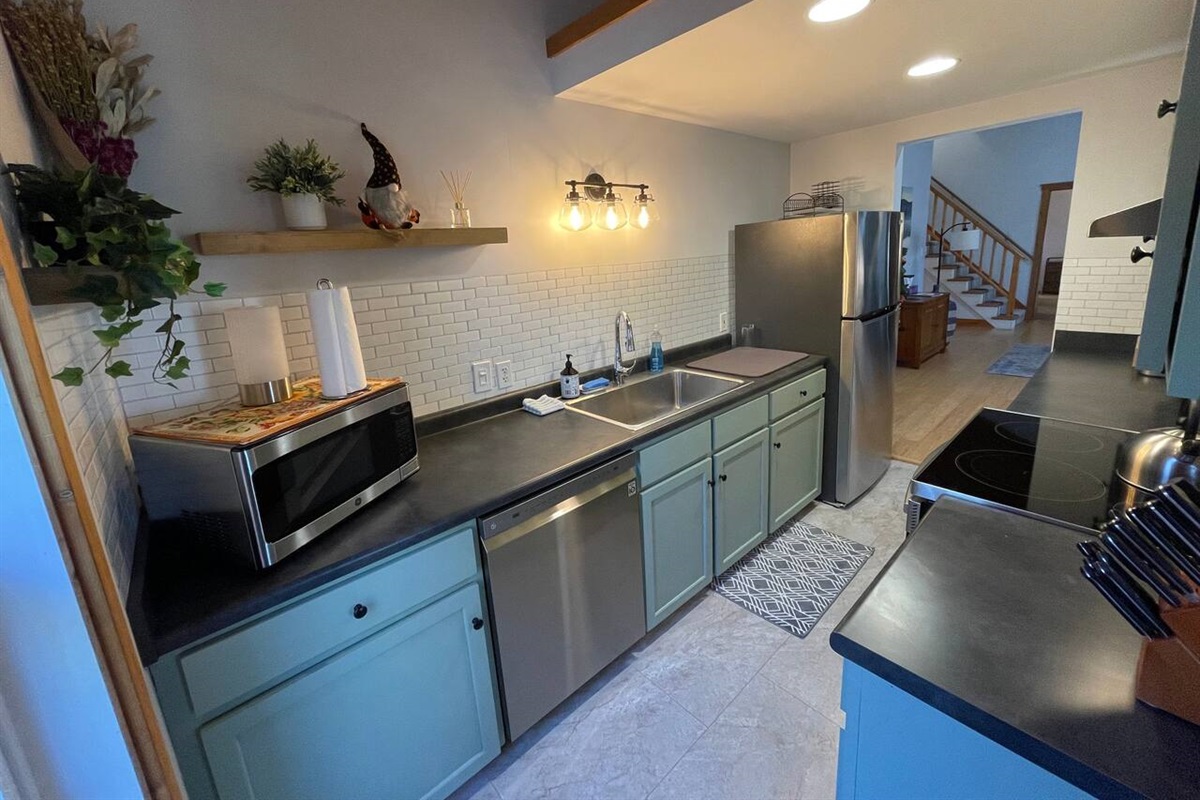 Galley kitchen with full size fridge