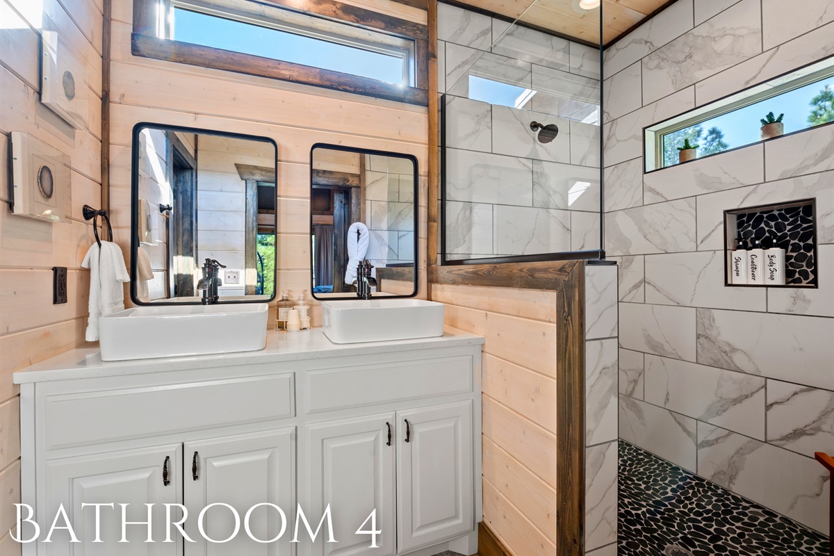 A bright and modern bathroom with clean lines and thoughtful touches to make your stay comfortable.