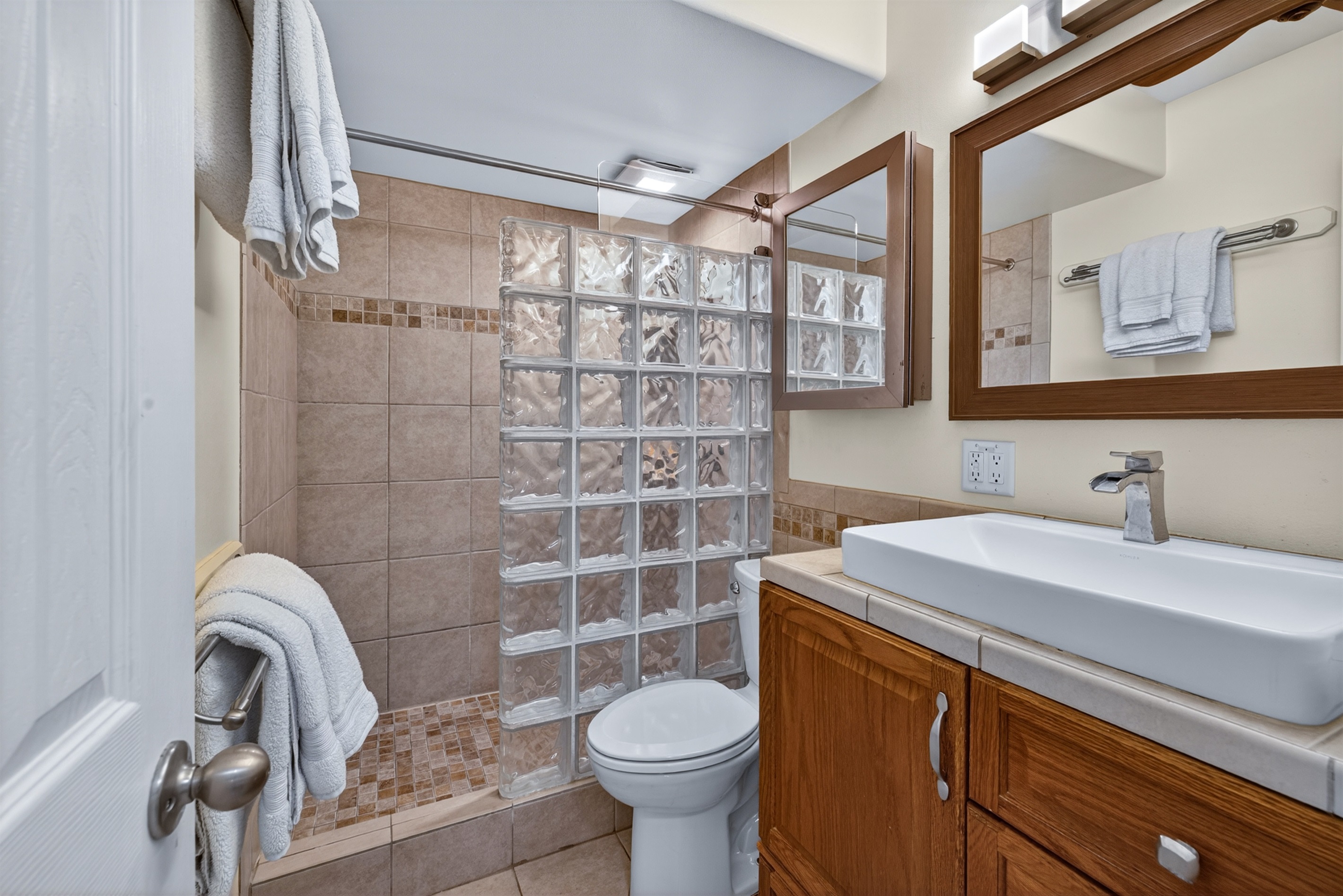 Clean, modern bathroom with a spacious walk-in shower—perfect for refreshing after a day at the beach.