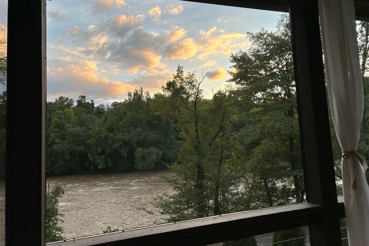 Late day changing clouds and light as seen from the dining porch