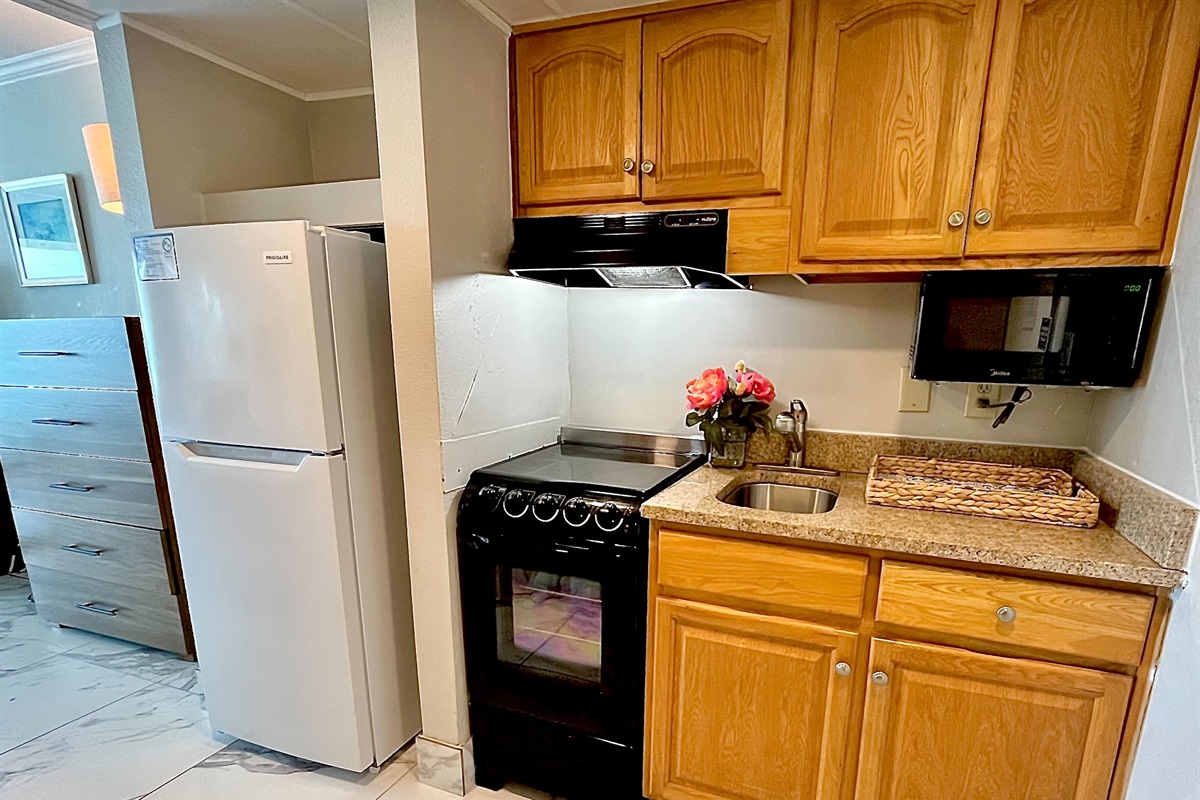 Prepare meals with ease in the convenient kitchenette, complete with all necessary appliances.
