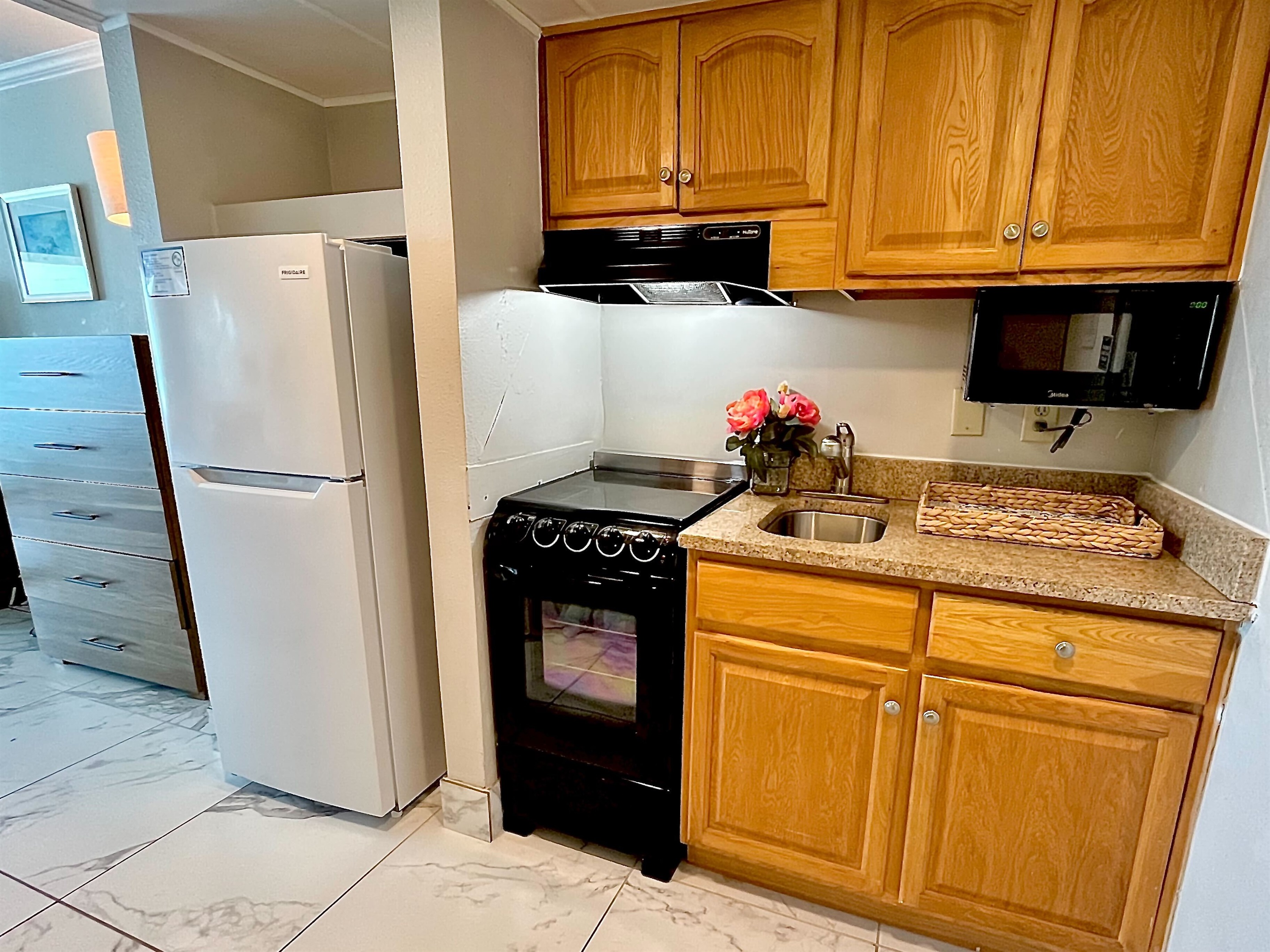 Prepare meals with ease in the convenient kitchenette, complete with all necessary appliances.