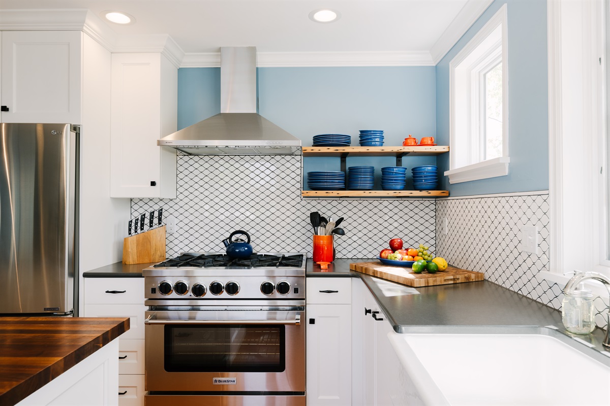 Gourmet kitchen with BlueStar gas range with 6 burners.