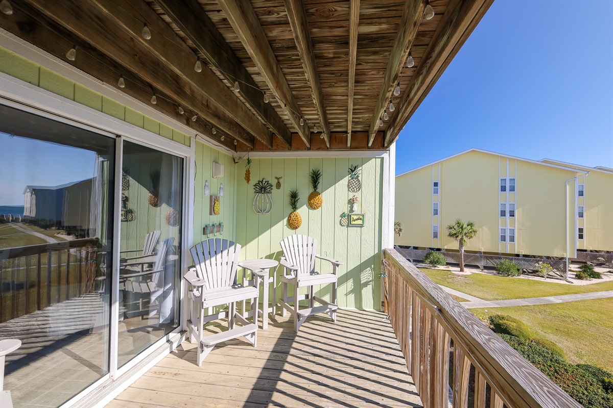 Relax on your private balcony with comfortable seating and peaceful courtyard views