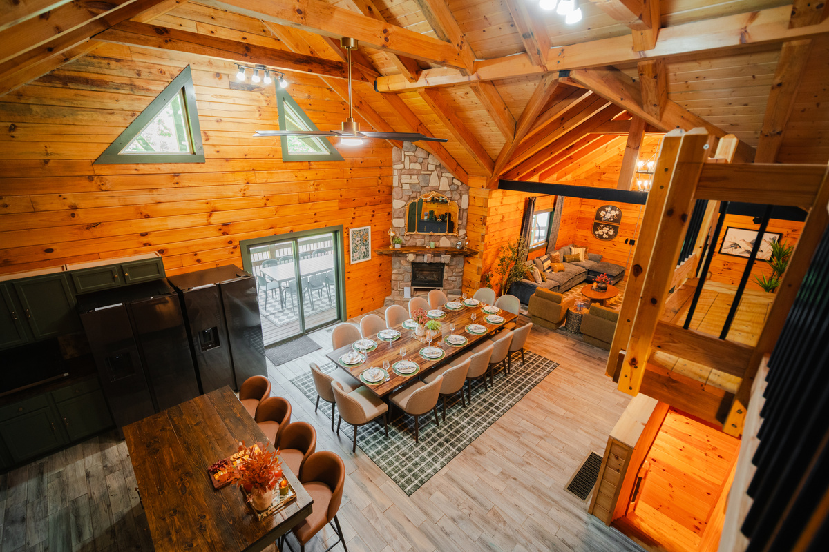 A bird’s-eye view of the open-concept kitchen, dining, and living area - designed for gathering, dining, and relaxing together.
