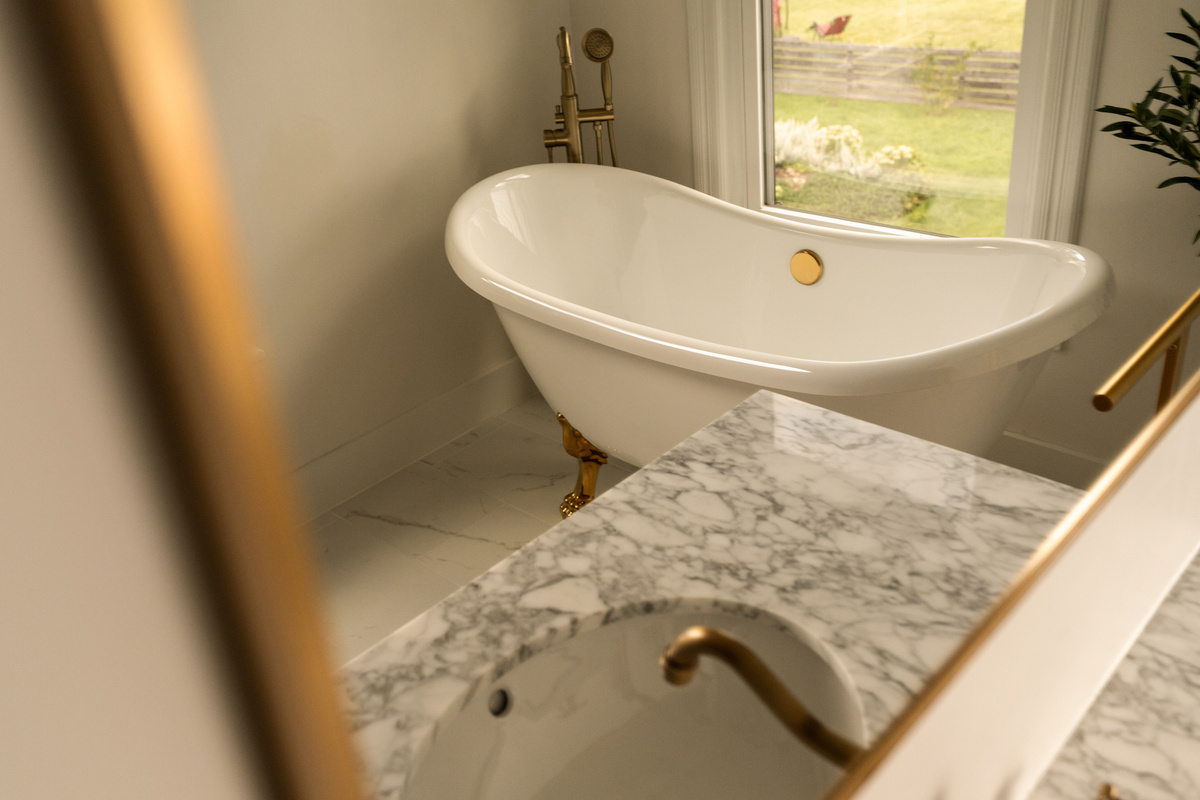 The primary en-suite features a beautiful clawfoot tub with shower, bringing a little old-house character into a freshly updated space.