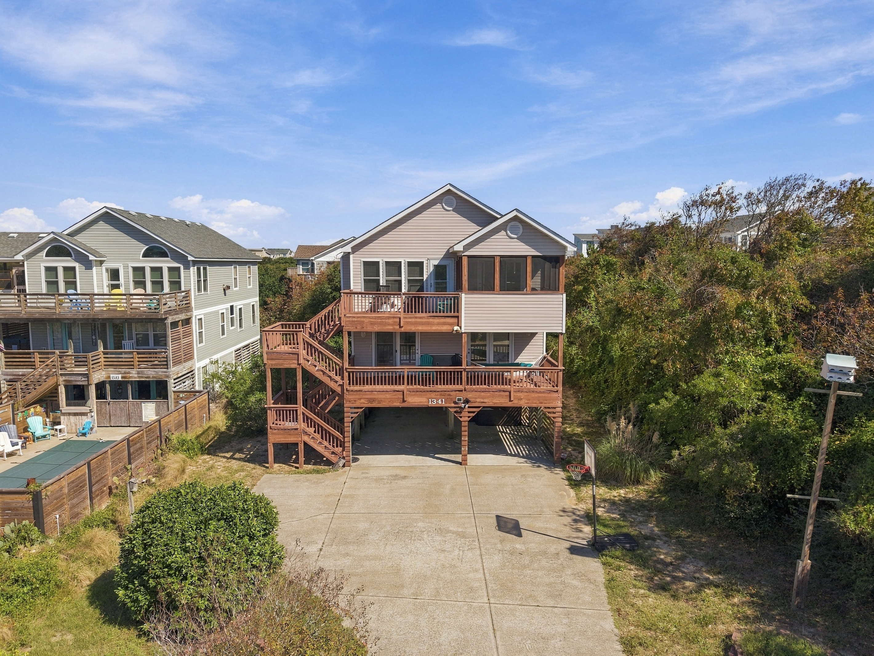 Welcome to Sunny Lagoon! Three levels of decks, a screened porch and a hot tub, tucked between the sound and the sea in Duck.