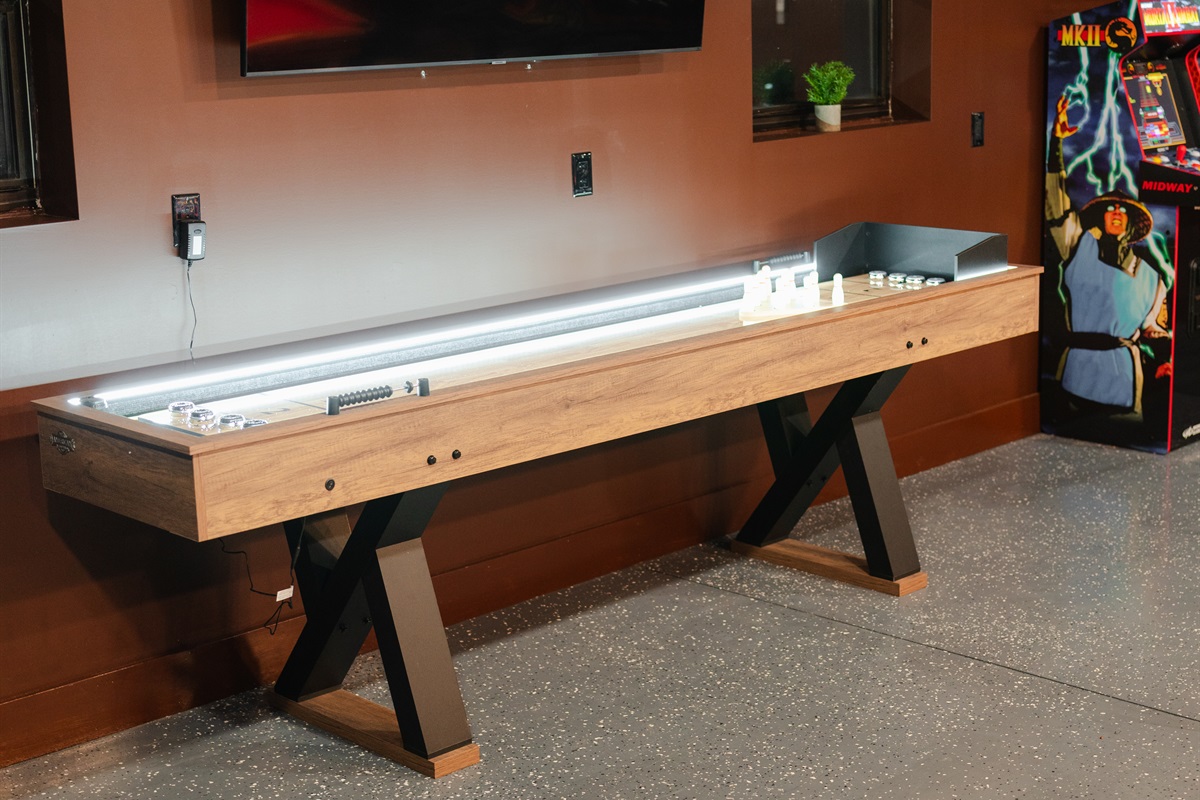 The shuffleboard table gives the game room another fun spot for a little friendly competition.