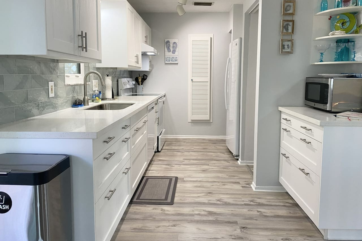 Clean up is a breeze with large sink, dishwasher and even the high capacity washer and dryer in the garage below! 