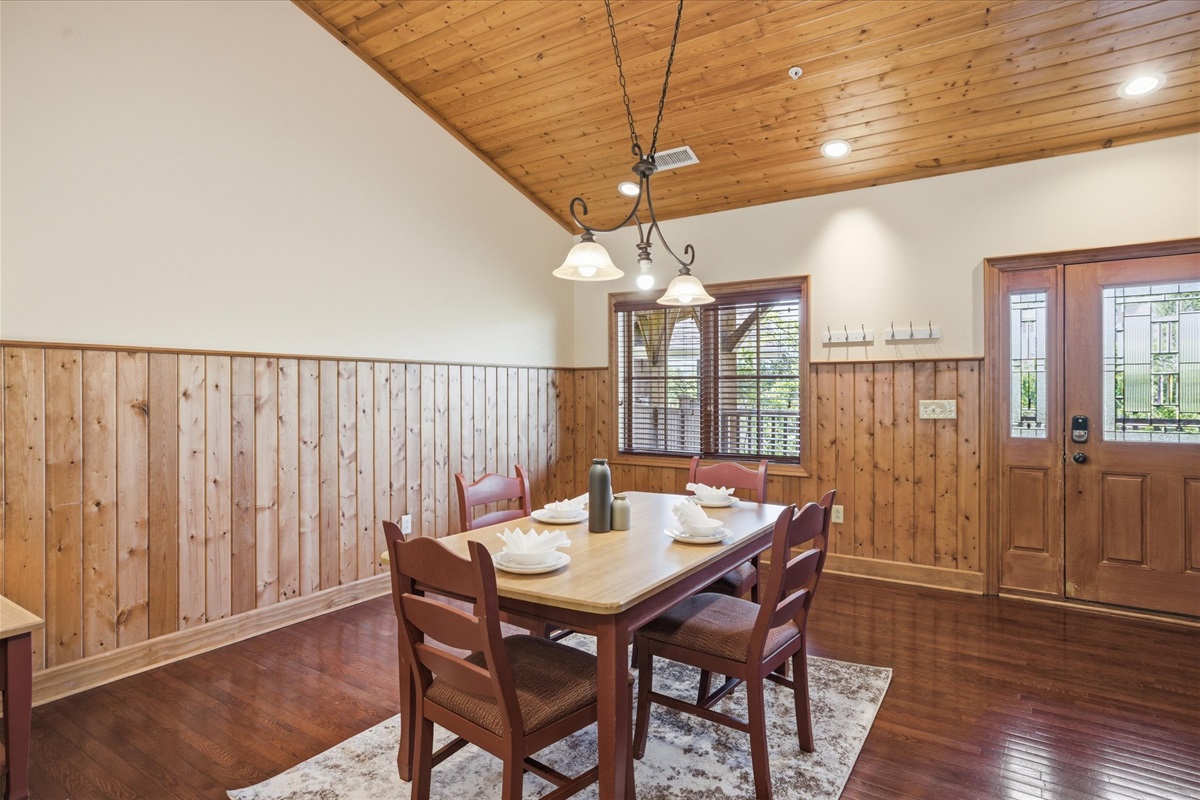 Gather at the dining table in Unit 321, a comfortable space to share meals, catch up, or sit down together and plan the day ahead before heading out.