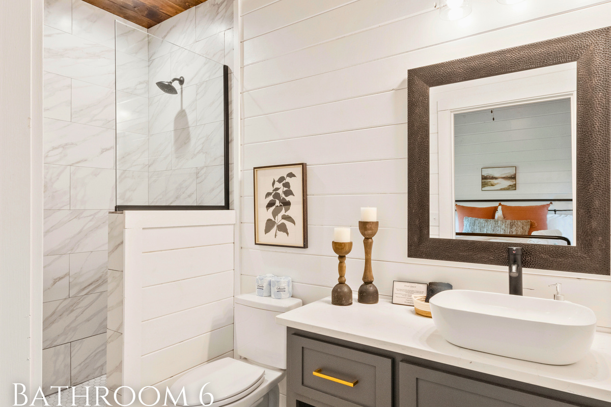 Step into our bright bathroom where sleek tile meets rustic charm &ndash; the perfect place to start your day refreshed.