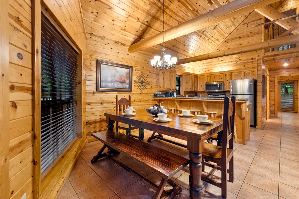 Spacious dining room with warm wood finishes and big windows.