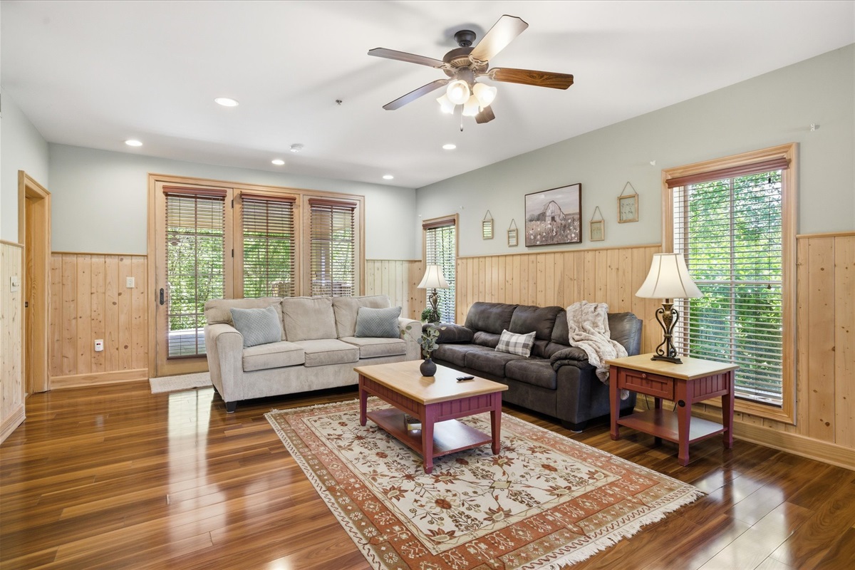 Kick back in the cozy living room with comfortable seating and a TV, the perfect spot to relax, recharge, and enjoy a quiet evening in.