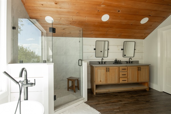 King Suite 1 Bathroom | Spa-style bath with soaking tub, walk in shower and dual vanities