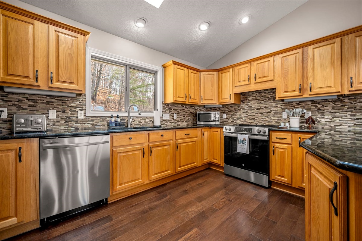Fully stocked kitchen with stainless steel appliances and more