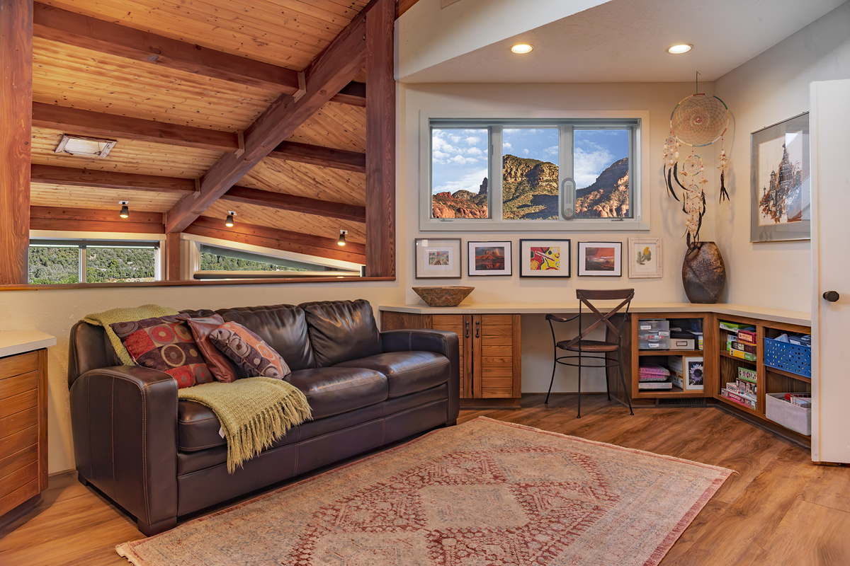 The loft and media room features a convenient workspace.