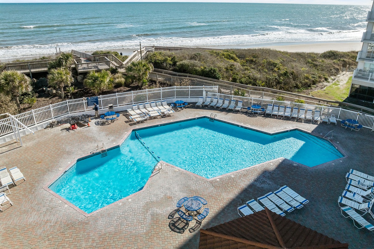 Resort-style seasonal pool just steps from the sand with direct access to the beach right beyond
