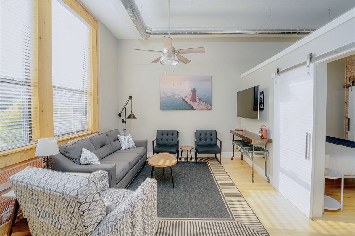 Settle in and watch a movie or your favotire show! The living room is a great spot for relaxing. Featuring a cozy pullout couch, a reclining chair, 2 siting chairs, and a smart TV. 