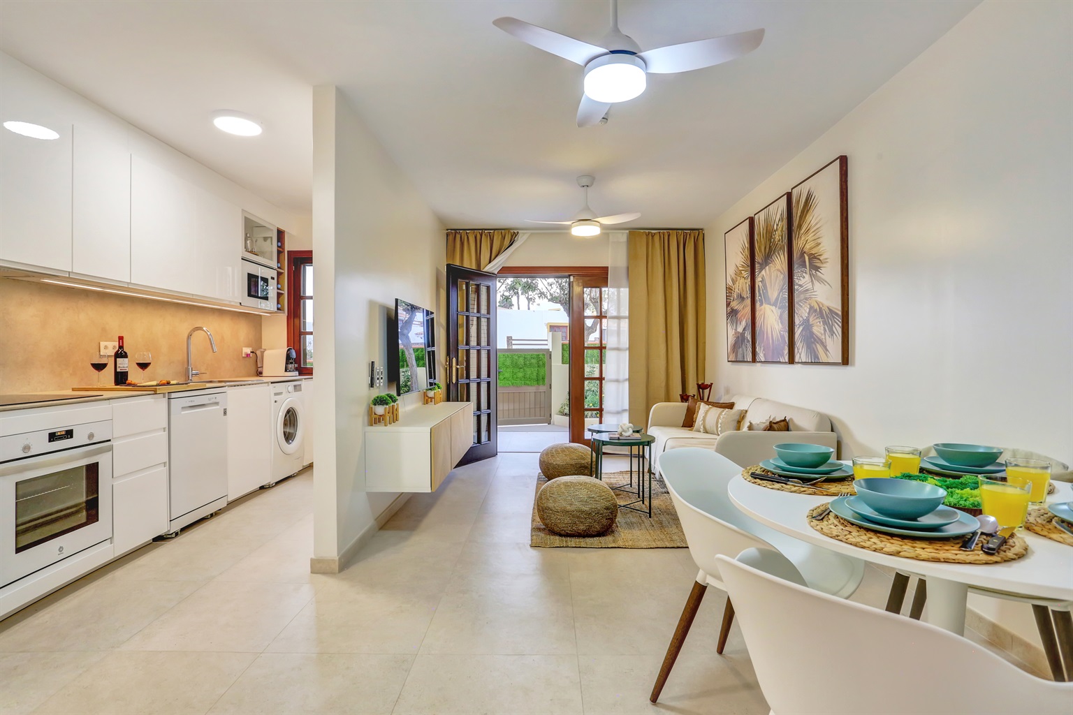 Spacious open-plan area combining a fully equipped kitchen, dining space, and living room, designed for comfort and a practical, enjoyable stay.