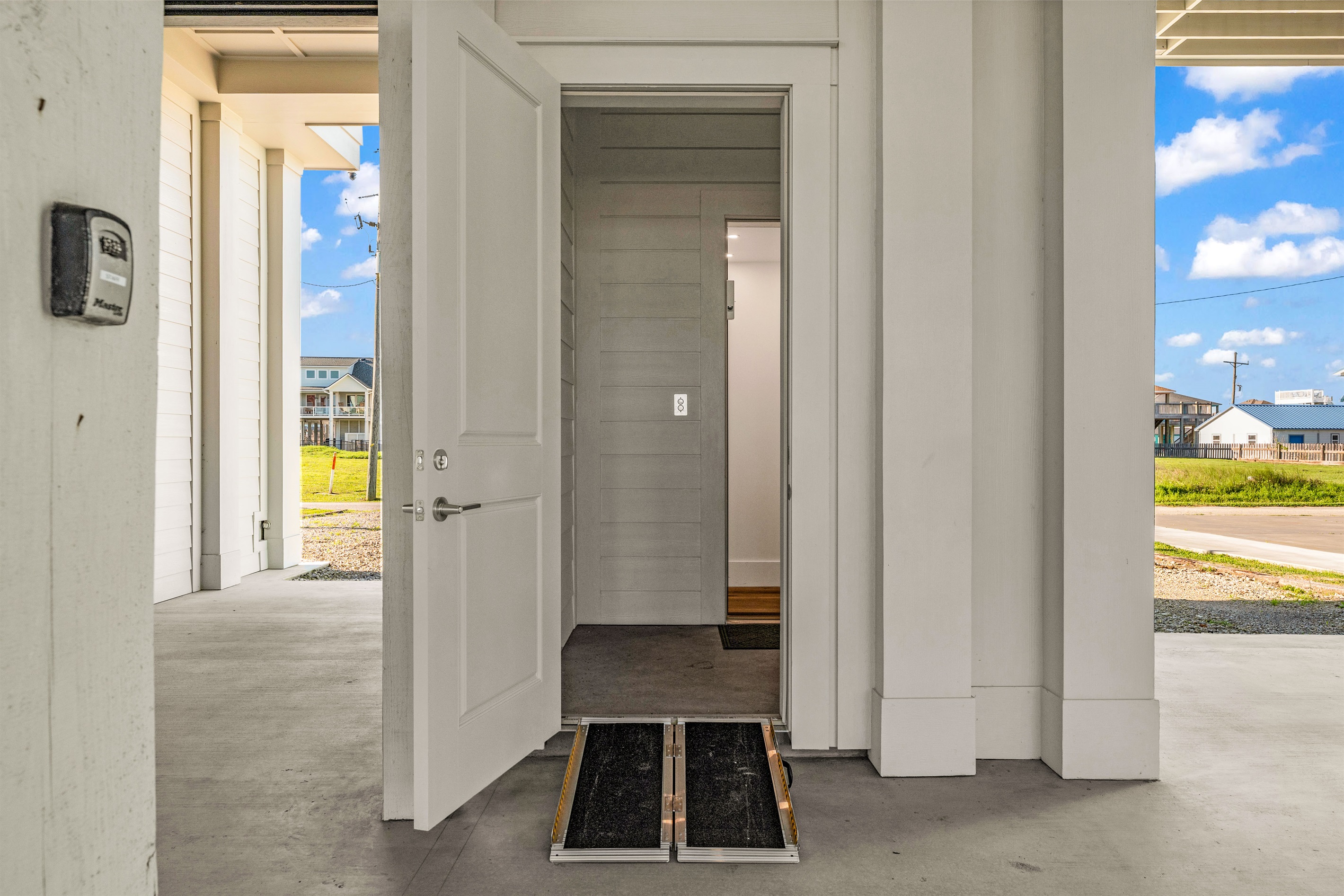 Costa Cristal Exterior: Exterior view showing the wheelchair-accessible ramp, ensuring comfortable and inclusive access for all guests.