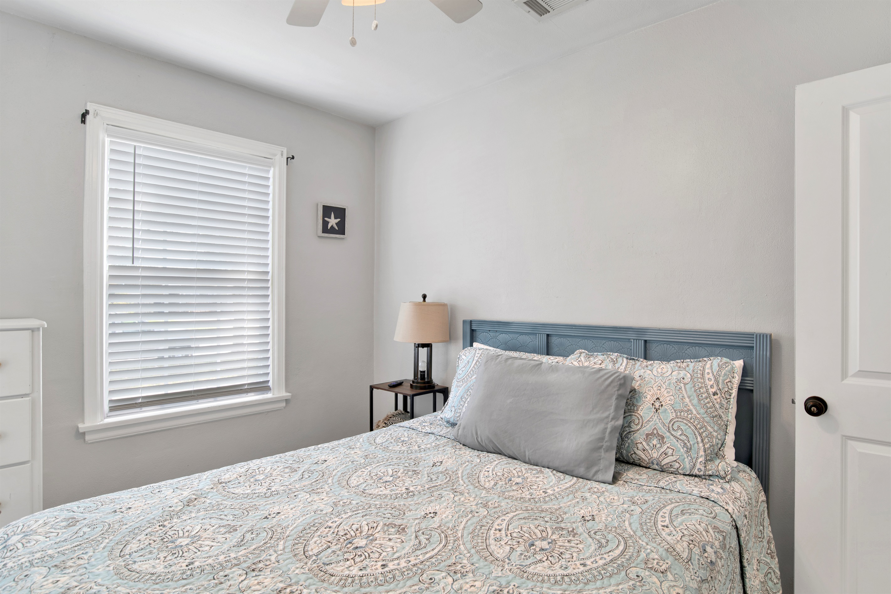 Bright and comfortable queen bedroom.