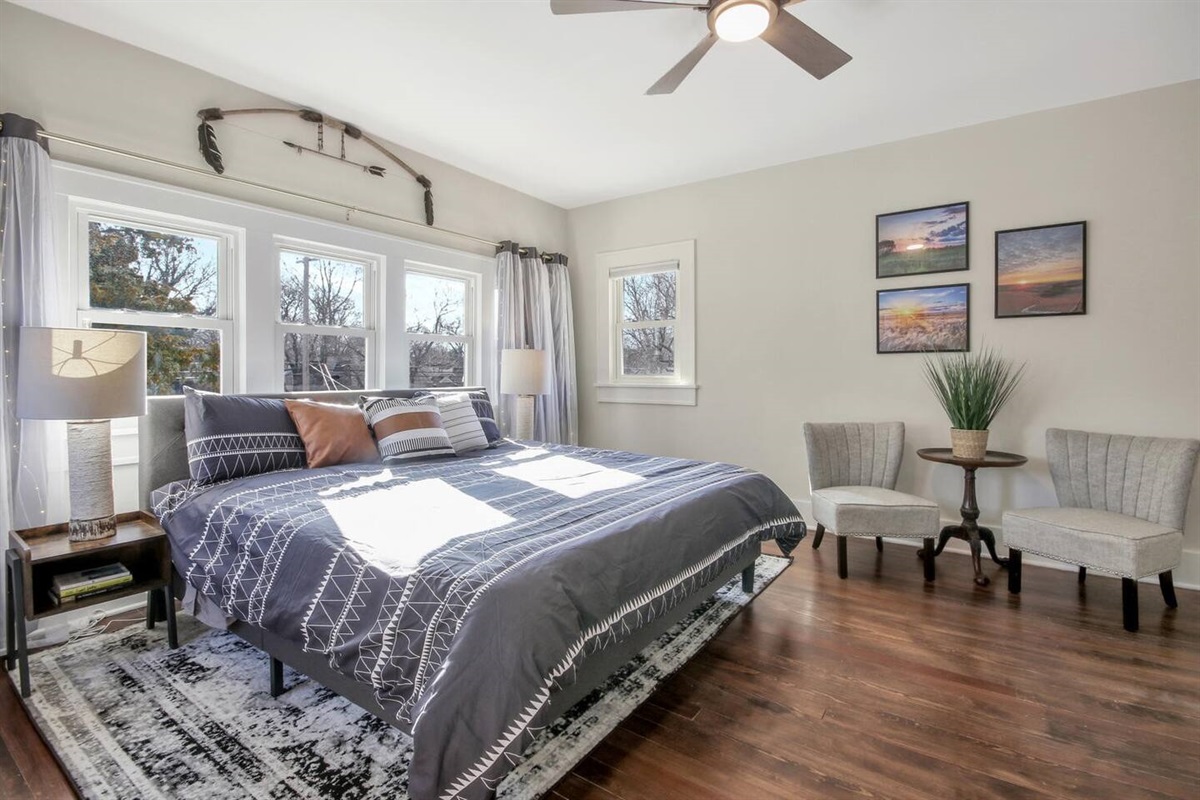 The Flint Hills Suite features a King size bed, artwork from various local artists and a full on-suite bathroom.  This room also has a smart TV to unwind after a full day of activities.