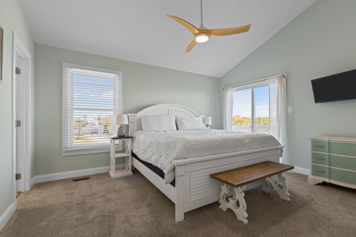 Retreat to your serene master bedroom, where coastal comfort and private balcony access set the tone for restful mornings and peaceful nights